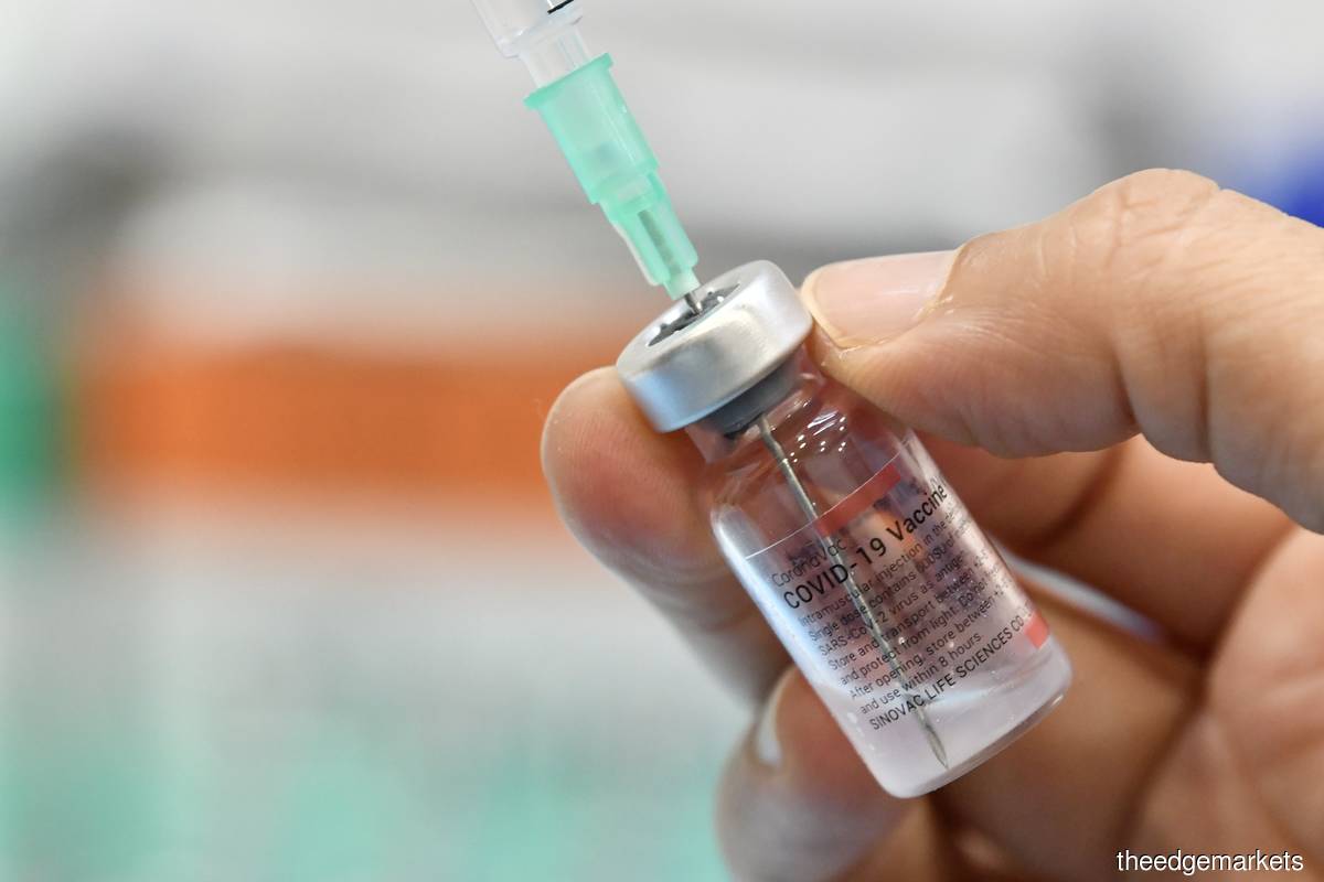 Khairy says Pharmaniaga has completed supplying its Sinovac vaccine doses to the federal government under PICK. (Photo by Sam Fong/The Edge)